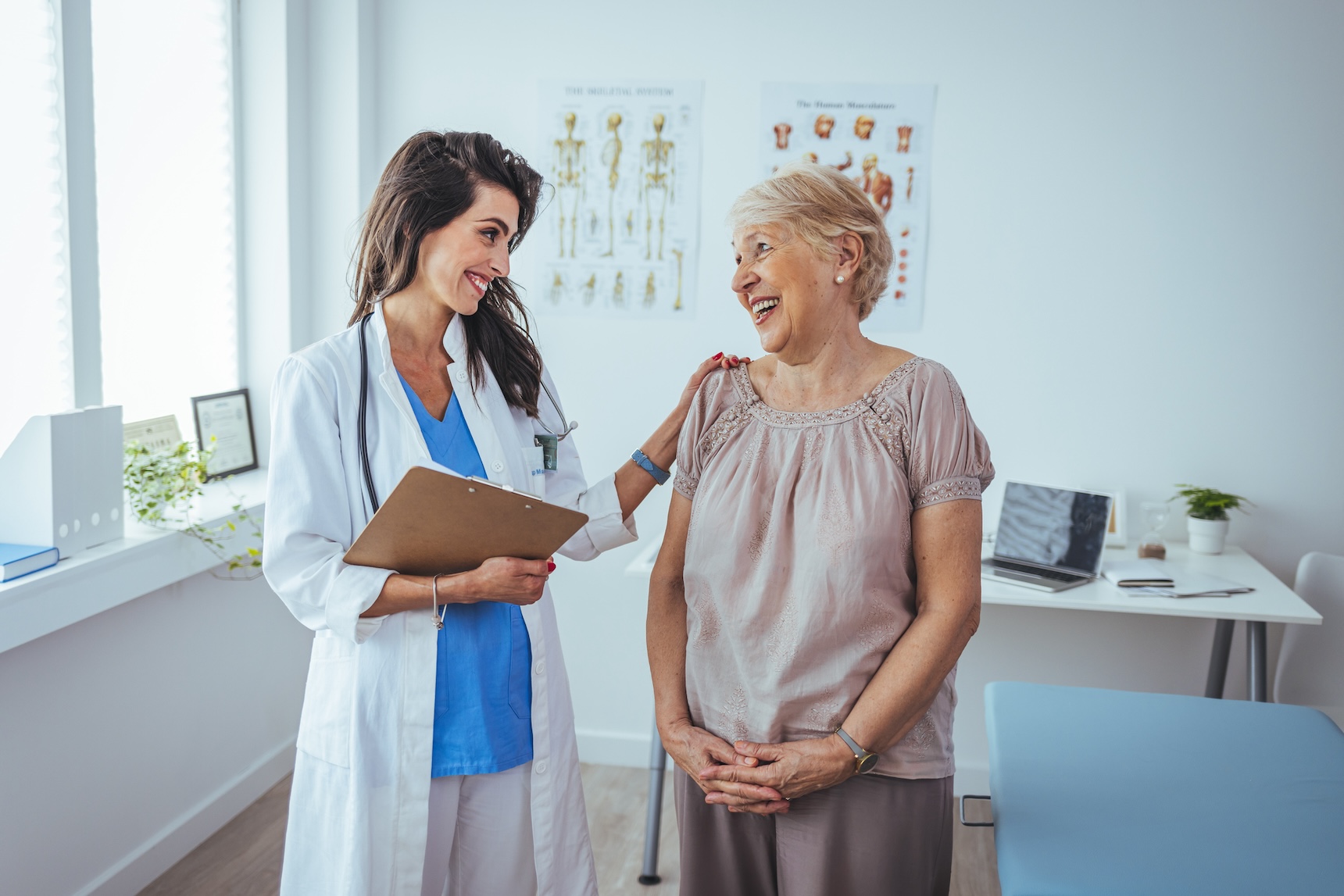 Doctor and patient during medical consultation in the doctor's office. Doctor working in the office and listening to the patient, she is explaining her symptoms