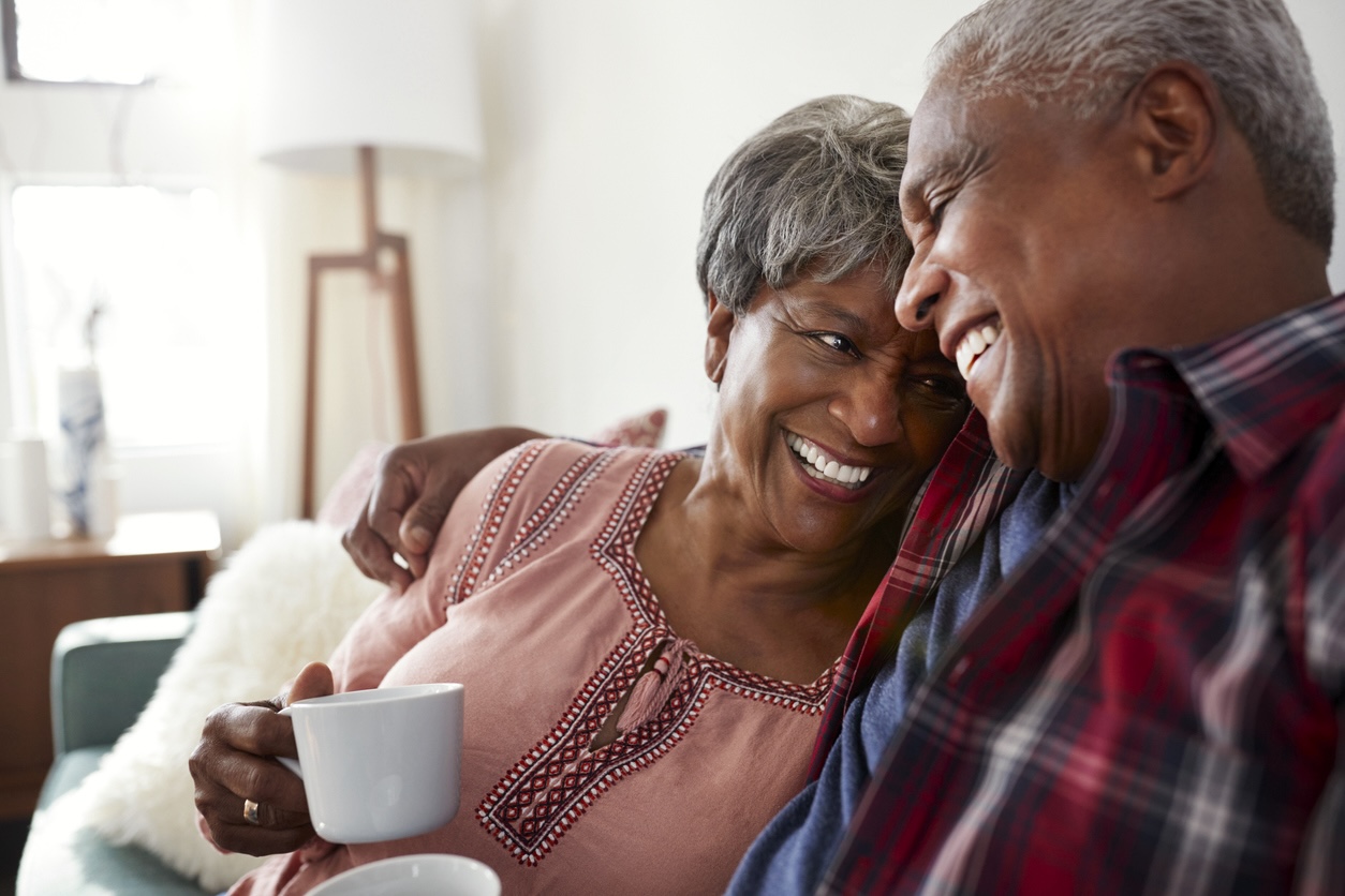 Senior couple relaxing at home enjoying maintenance-free senior living