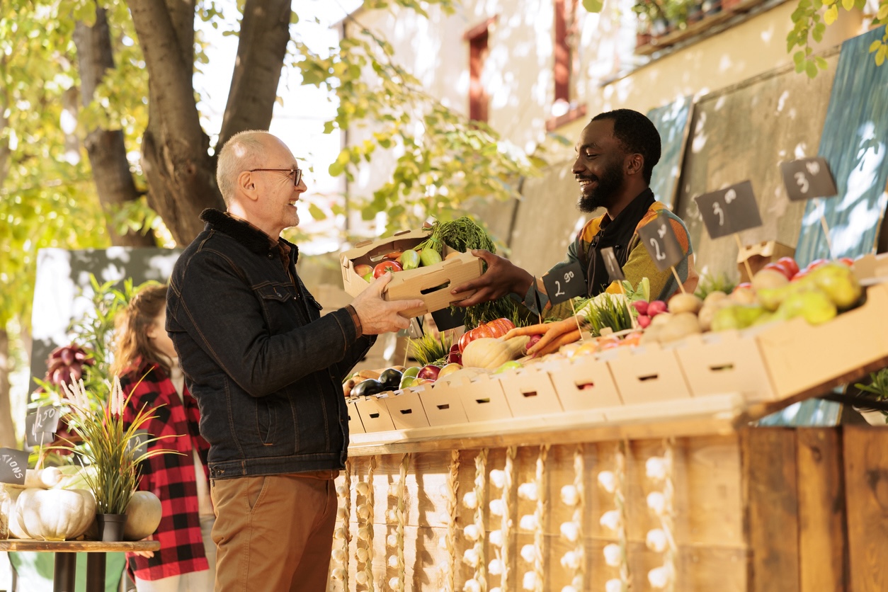 Senior adult visiting a farmers market during spring.