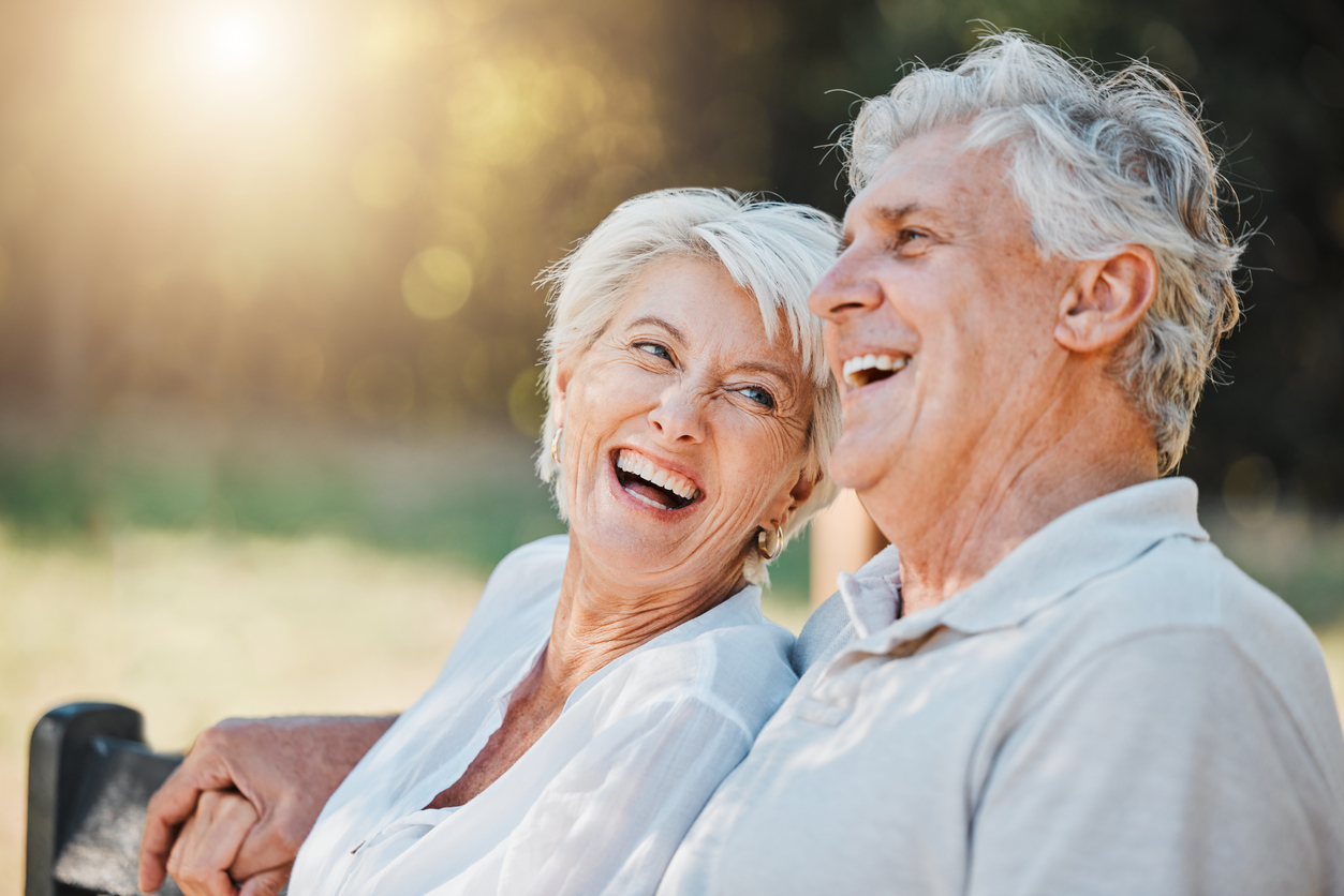 Senior couple enjoying a relaxing summer afternoon outdoors