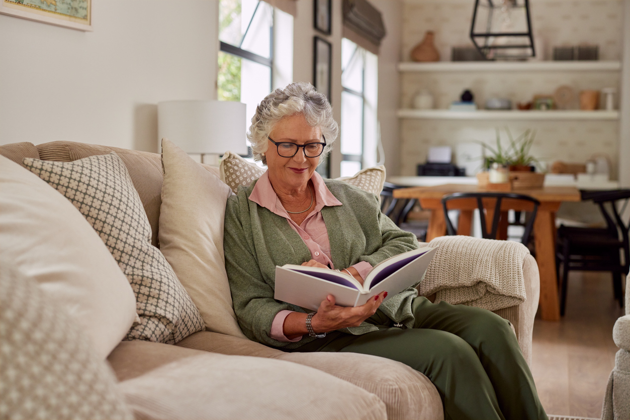 Senior woman enjoying a relaxing morning reading as part of a healthy daily routine for seniors