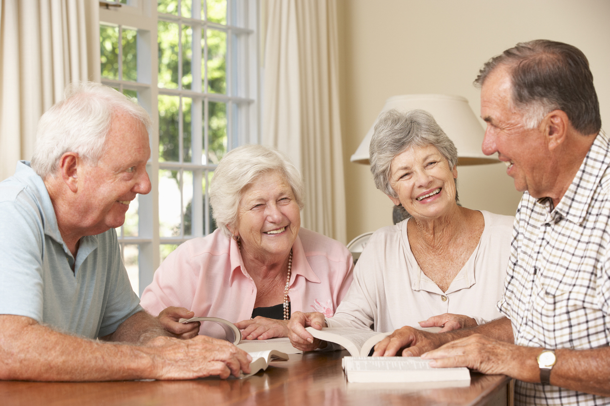 Senior adults reading together as part of brain-healthy activities that support memory