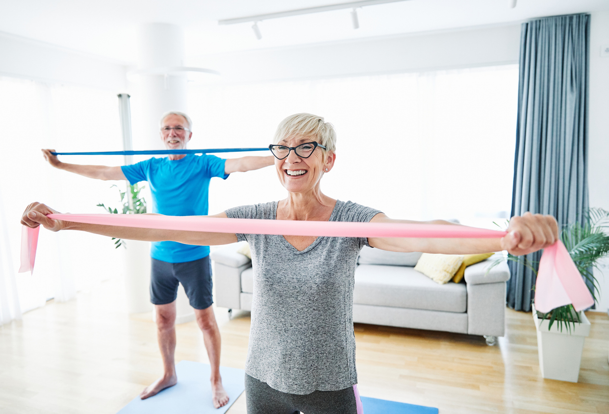 Senior adults exercising with resistance bands to support strength and healthy aging